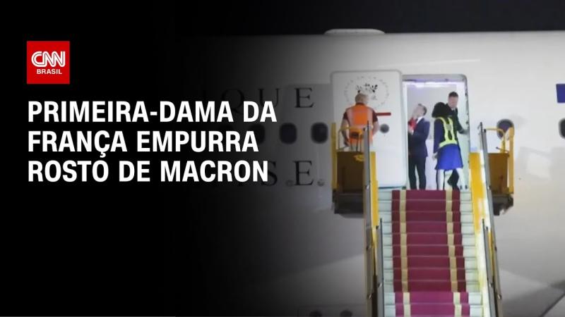Primeira-dama da França empurra rosto de Macron;